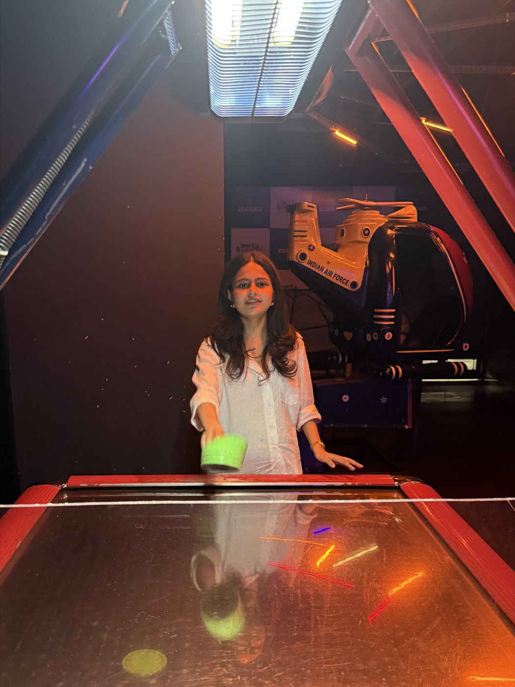 Ridhi playing air hockey